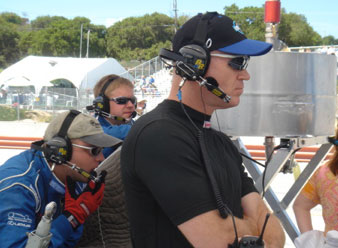 Randy watches the monitors with the crew at Laguna Seca